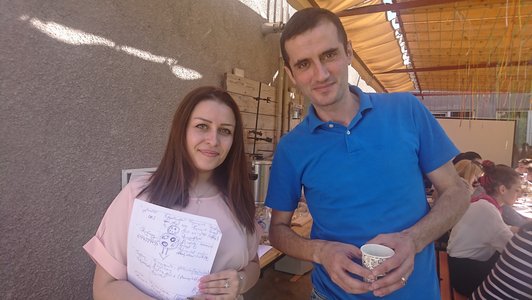 A woman and a man looking posing for a picture