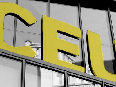 Three yellow letter showing a C, E and U. 