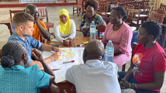 People sitting around a table and discussing.