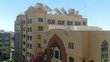 Beige building with solar panels on the roof