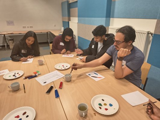 Photo of students participating in the activity "Paint Your Studies"