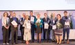 The award-winning teachers with certificates and bouquets of flowers in a group photo on the occasion of the awarding of the "Ars Docendi" State Prize.