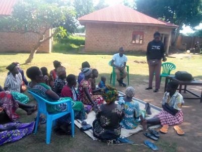 Students engage with farmers during a hands-on community practice activity 
