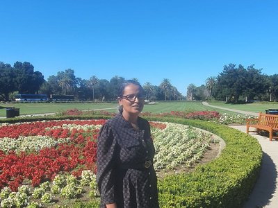 Photo of Meseret Desta with flowers in background