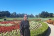 Photo of Meseret Desta with flowers in background