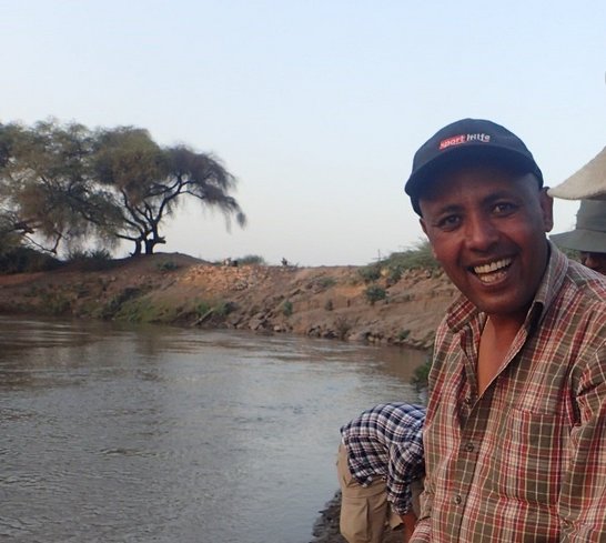 Dr. Aschalew at the middle-section of the Awash river helping fish scientist to gather data