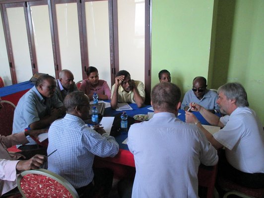 Group of people sitting around a table