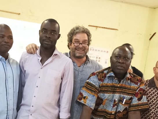 9 current and former SUSFISH scholars standing behind a table