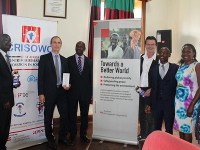 Peolpe staning side by side and next to big event posters