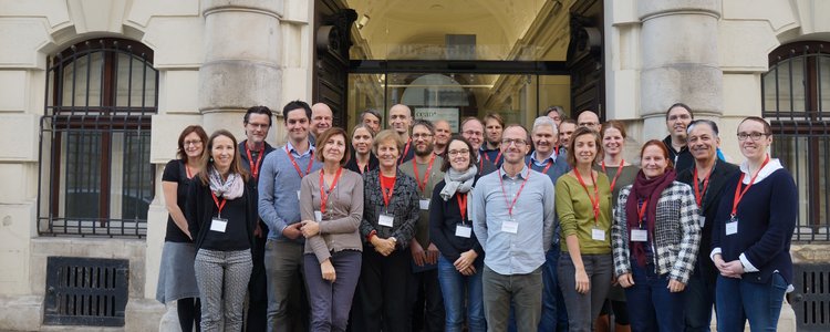 Group picture of 20 people standing in front of the OeAD