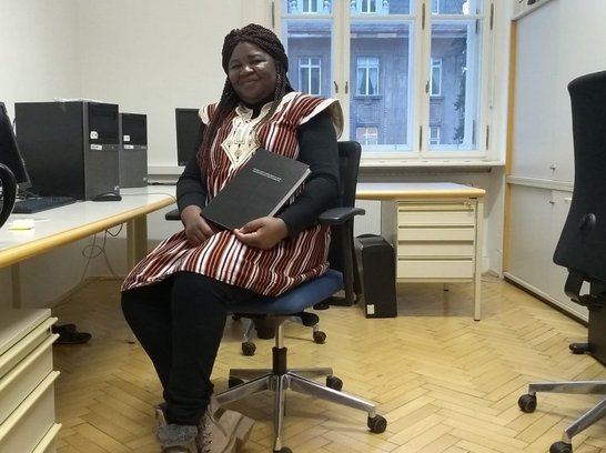 Bernadette Yougbaré in her office at BOKU with PhD thesis