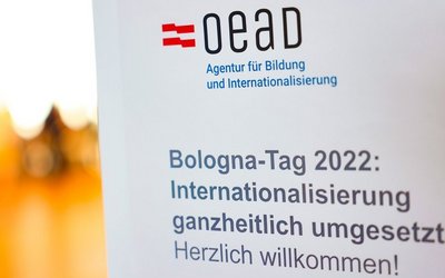 OeAD Logo mit Bildunterschrift zum Bologna-Tag 2022