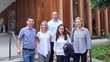 The project team (3 women, 2 men) stands on stairs in front of a BOKU building. 