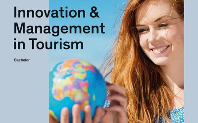 Information brochure for Innovation & Management in Tourism (Bachelor). On display is a young woman with a globe in her hand.