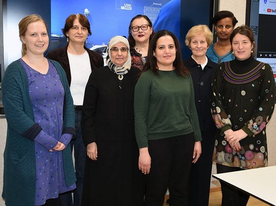 Group of people posing for a picture