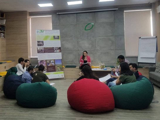 students sitting together discussing survey