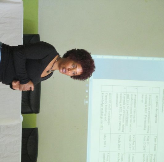 Woman standing in front of a presentation