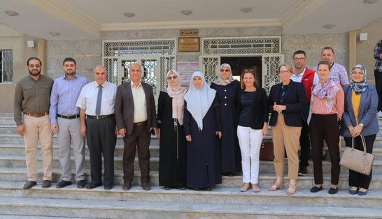 Several representatives of the Islamic university of Gaza and the Austrian Development Agency in front of the Women's Studies Center 