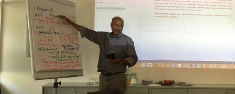 Man who presents something with powerpoint presentation and flip chart 