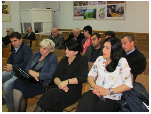 Group of people sitting arranged in rows